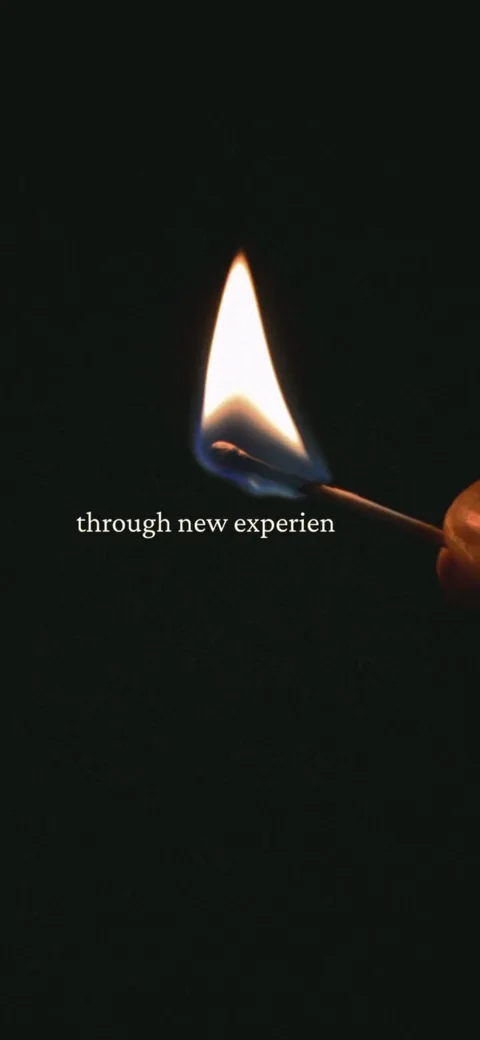 222 onboarding screen 20: Opening of a long cinematic brand film: a single lit match on black with 'through new experiences' set in a…