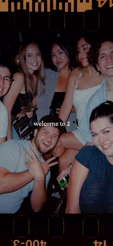 222 onboarding screen 30: 'welcome to 2' over a flash-lit candid of a young crowd throwing peace signs at a party