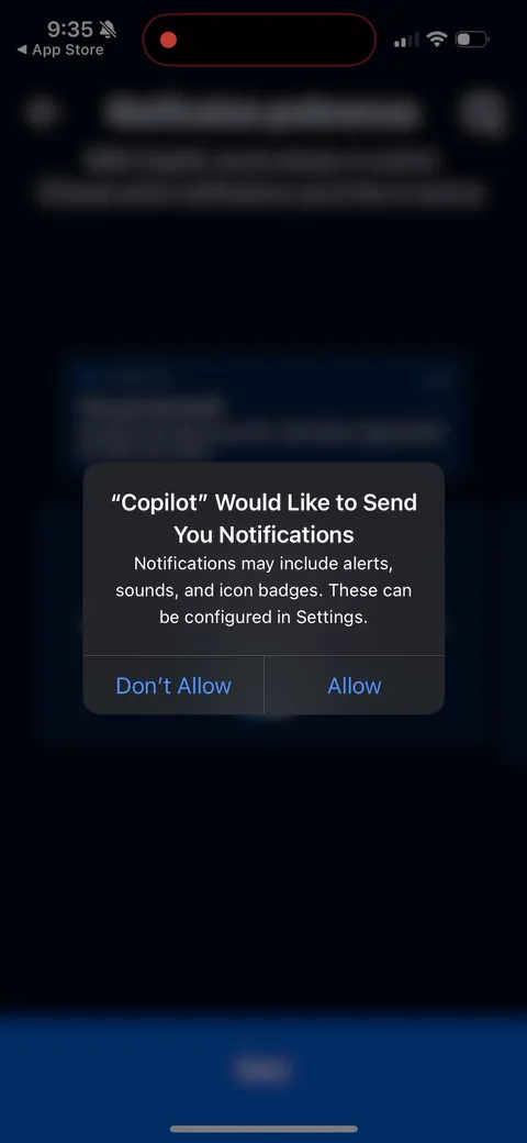 Copilot onboarding screen 15: The iOS system prompt fires right after those previews primed you on exactly what you'd get