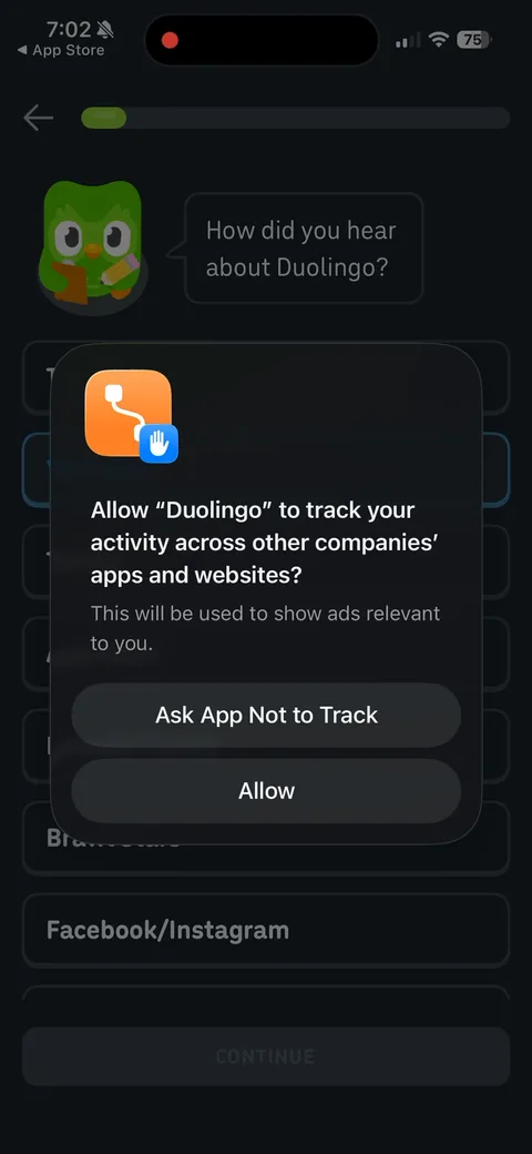 Duolingo onboarding screen 15: The ATT prompt fires right after the attribution question
