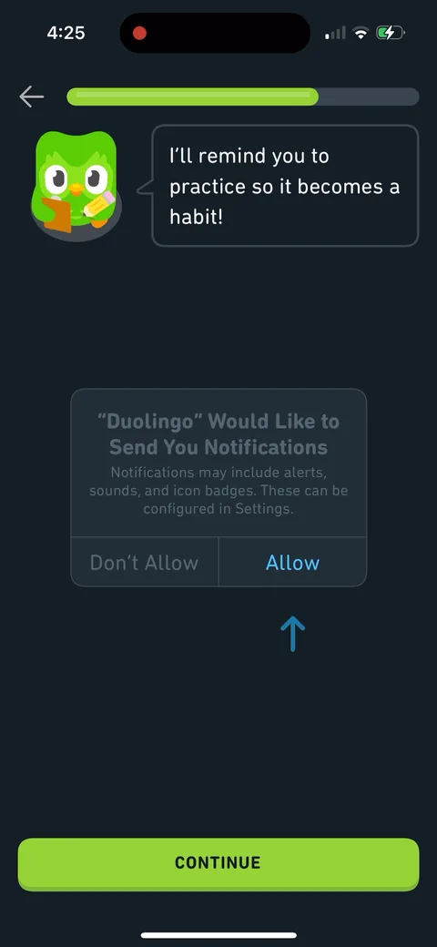 Duolingo onboarding screen 30: 'I'll remind you to practice so it becomes a habit!' from Duo, then the system dialog