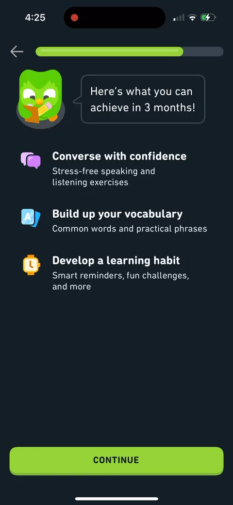 Duolingo onboarding screen 33: 'Here's what you can achieve in 3 months: converse with confidence, stress-free speaking.' Outcome framing…