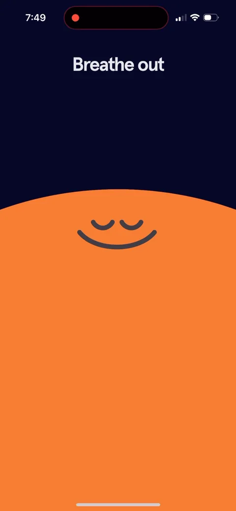 Headspace onboarding screen 5: The launch animation says 'Breathe out'