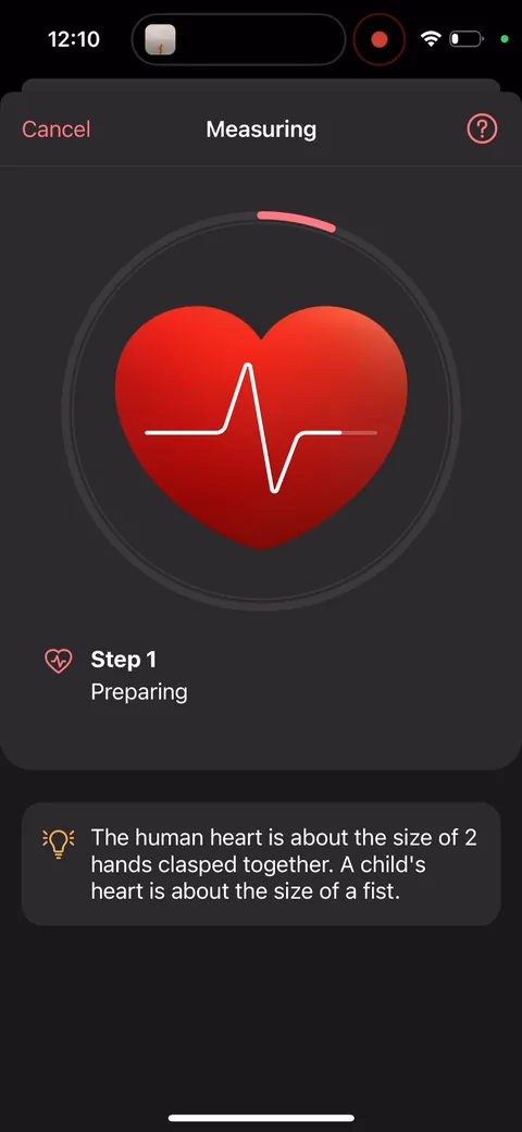 Inpulse onboarding screen 40: Heart trivia while it measures: 'The human heart is about the size of 2 hands clasped together.' Fills the…