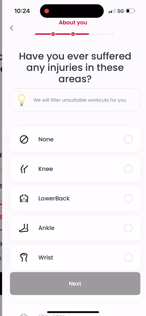 Justfit onboarding screen 30: Injury question framed as filtering: 'we will filter unsuitable workouts for you.' Reframes a dull health…