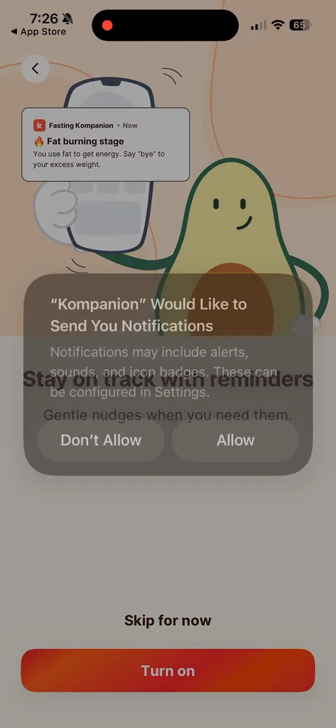 Kompanion onboarding screen 32: Notification ask right after goal weight, with a sample push in the background ('Fat burning stage