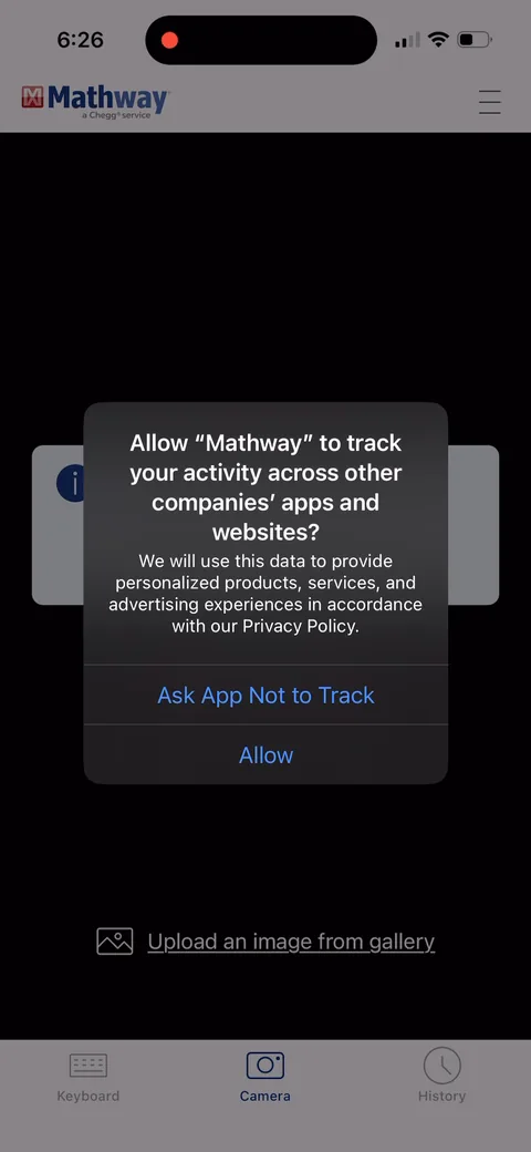 Mathway onboarding screen 6: The ATT tracking prompt stacked right behind the camera prompt