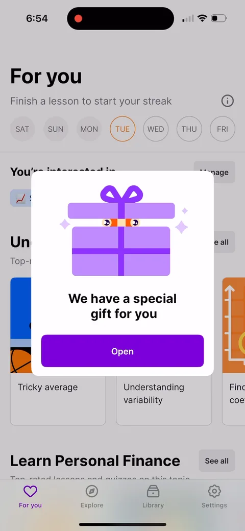 Nibble onboarding screen 46: 'We have a special gift for you', wrapped as a present