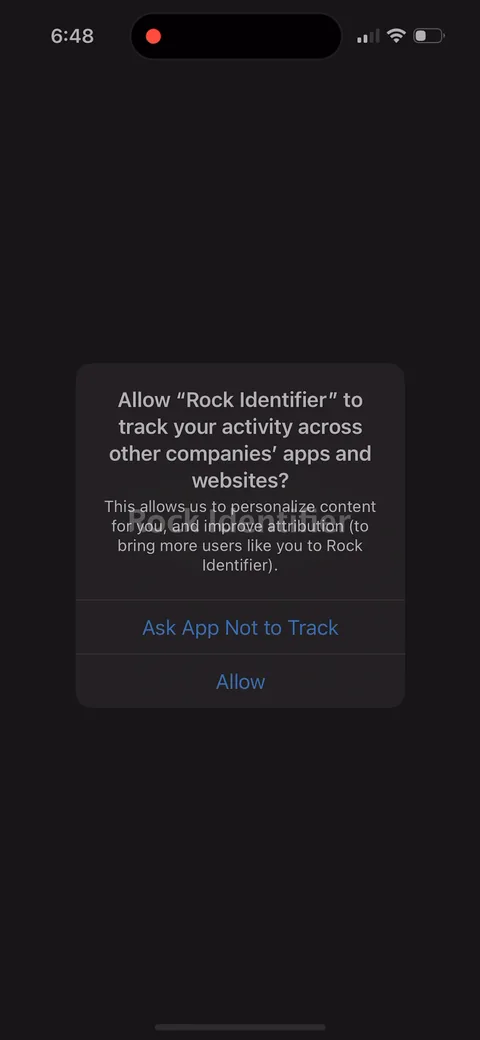Rock Identifier onboarding screen 3: The ATT prompt on screen three, with their own explainer sitting above Apple's dialog: 'to bring more users…